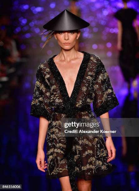 Model walks the runway at the Ozgur Masur show during Mercedes-Benz Istanbul Fashion Week September 2017 at Zorlu Center on September 12, 2017 in...