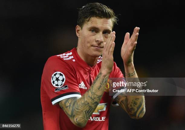 Manchester United's Swedish defender Victor Lindelof applauds the fans following the UEFA Champions League Group A football match between Manchester...
