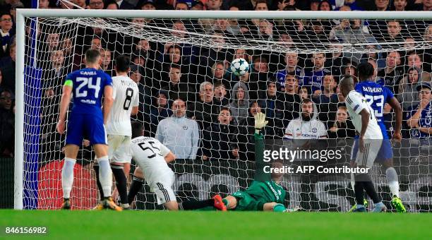Qarabag's Bosnian goalkeeper Ibrahim Sehic fails to save a shot from Chelsea's French midfielder Tiemoue Bakayoko , resulting in Chelsea's fourth...