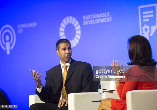 Ajit Pai, chairman of the Federal Communications Commission , speaks as Meredith Attwell Baker, chief executive officer of Cellular...
