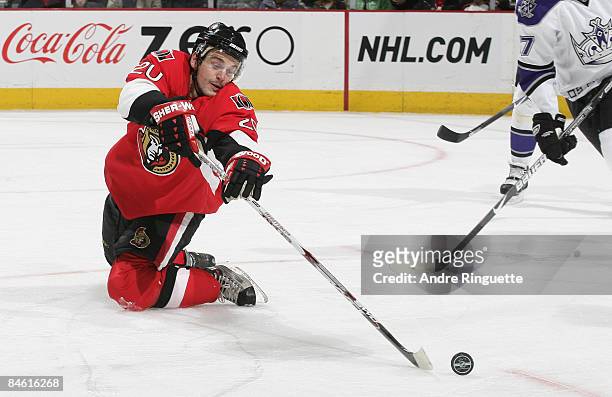 Antoine Vermette of the Ottawa Senators reaches behind himself for a loose puck from his knees against the Los Angeles Kings at Scotiabank Place on...