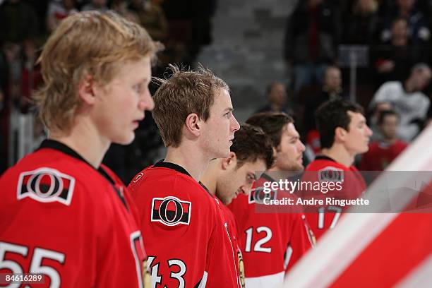 Peter Regin of the Ottawa Senators looks on with the starting lineup during the singing of the national anthems prior to a game against the Los...