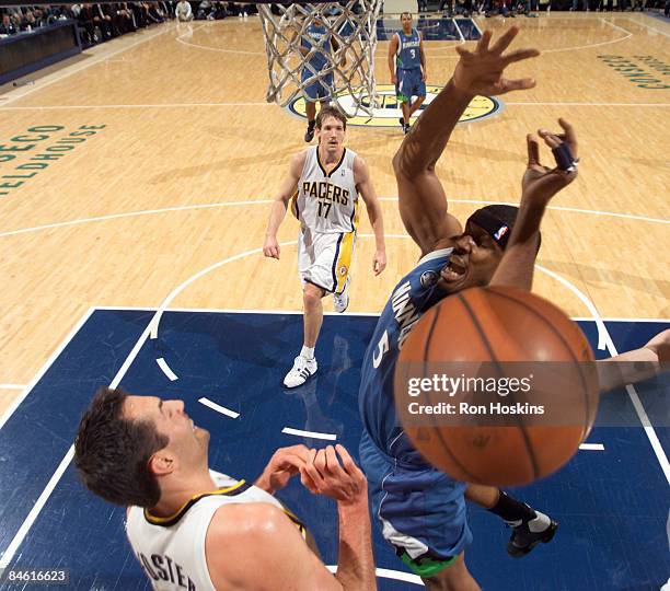 Craig Smith of the Minnesota Timberwolves loses the ball against Jeff Foster of the Indiana Pacers at Conseco Fieldhouse February 3, 2009 in...