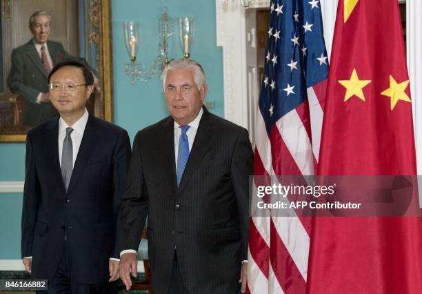 Secretary of State Rex Tillerson walks with Chinese State Councilor Yang Jiechi towards the Treaty Room for a photo opportunity shortly before their...
