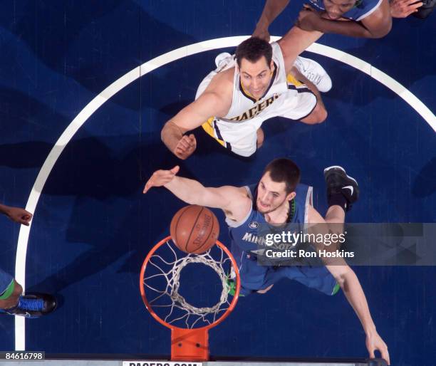 Kevin Love of the Minnesota Timberwolves rebounds over Jeff Foster of the Indiana Pacers at Conseco Fieldhouse February 3, 2009 in Indianapolis,...