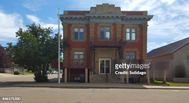 small town bassano heritage post office building - small office building exterior stock pictures, royalty-free photos & images