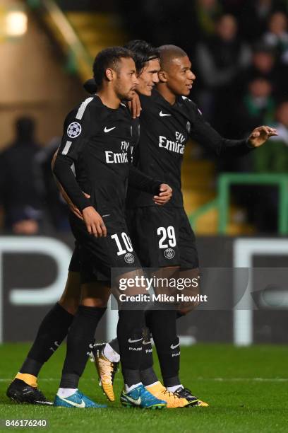 Neymar of Paris Saint Germain celebrates with Edinson Cavani and Kylian Mbappe after opening the scoring during the UEFA Champions League Group B...