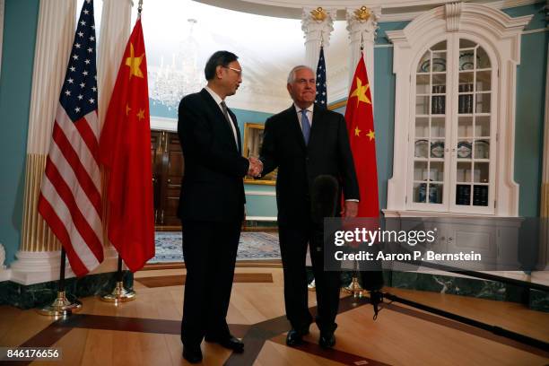 September 12: U.S. Secretary of State Rex Tillerson greets Chinese State Councilor Yang Jiechi at the State Department September 12, 2017 in...