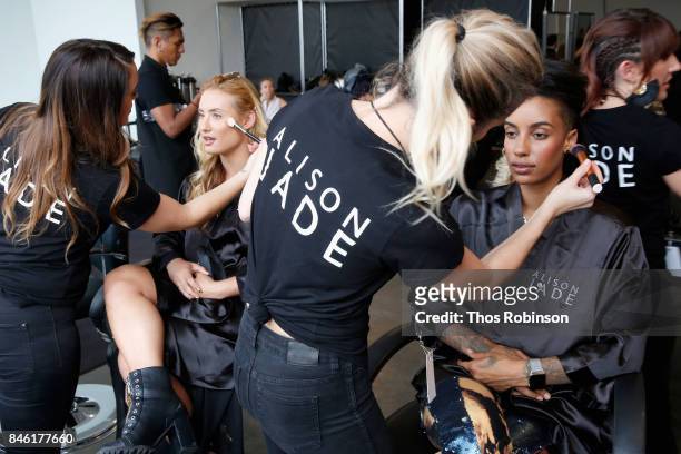 Montana Tucker and Azmarie Livingston prepare backstage for the Palette New York Fashion Week Spring/Summer 2018 at Pier 59 on September 12, 2017 in...