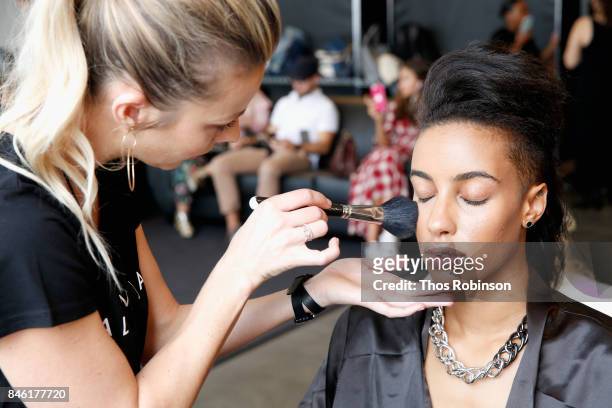 Actress Azmarie Livingston prepares backstage for the Palette New York Fashion Week Spring/Summer 2018 at Pier 59 on September 12, 2017 in New York...