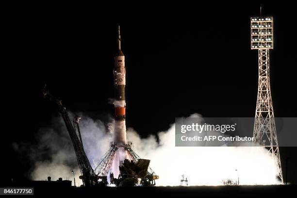 Russia's Soyuz MS-06 spacecraft carrying the members of the International Space Station expedition 53/54, US astronauts Joseph Akaba and Mark Vande...