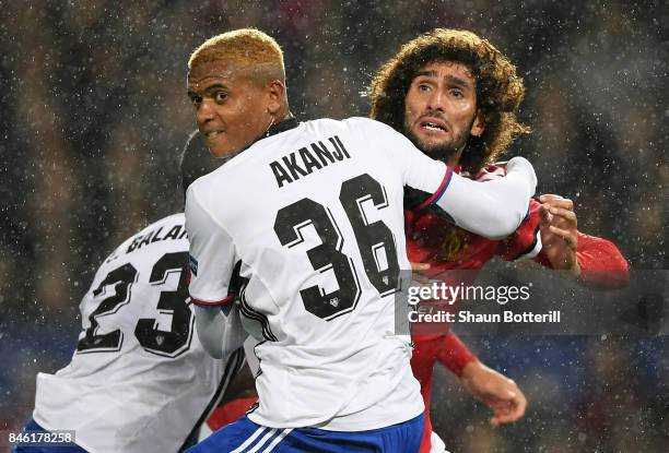 Manuel Akanji of FC Basel and Marouane Fellaini of Manchester United battle for possession during the UEFA Champions League Group A match between...