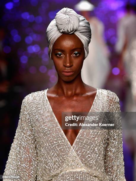 Model walks the runway at the Ozgur Masur show during Mercedes-Benz Istanbul Fashion Week September 2017 at Zorlu Center on September 12, 2017 in...