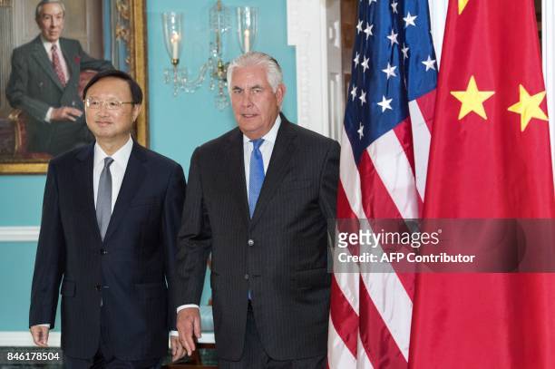 Secretary of State Rex Tillerson and Chinese State Councilor Yang Jiechi walk together towards the Treaty Room for a photo opportunity before their...