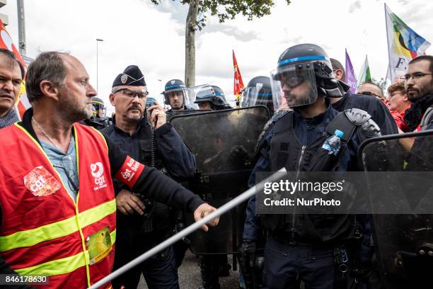 Demonstrators take part in a protest called by several French unions against the labour law reform in Lyon, on September 12, 2017. French unions...