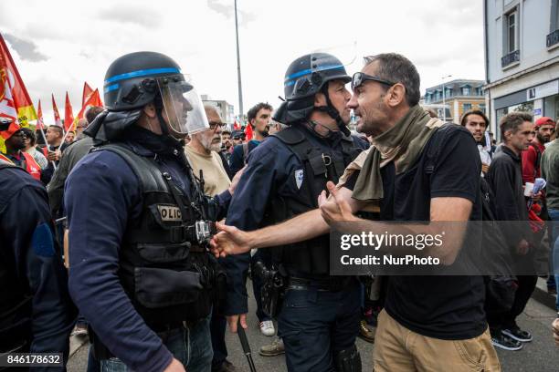 Demonstrators take part in a protest called by several French unions against the labour law reform in Lyon, on September 12, 2017. French unions...