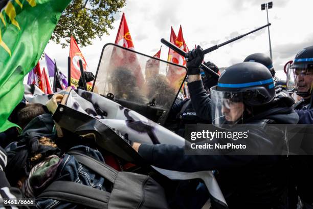 Demonstrators take part in a protest called by several French unions against the labour law reform in Lyon, on September 12, 2017. French unions...