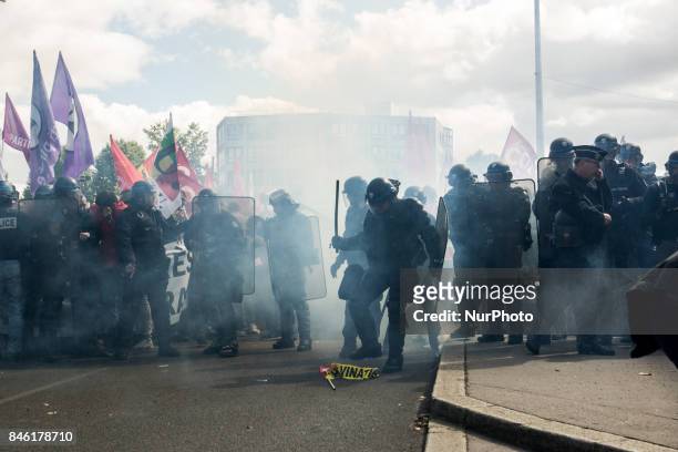 Demonstrators take part in a protest called by several French unions against the labour law reform in Lyon, on September 12, 2017. French unions...