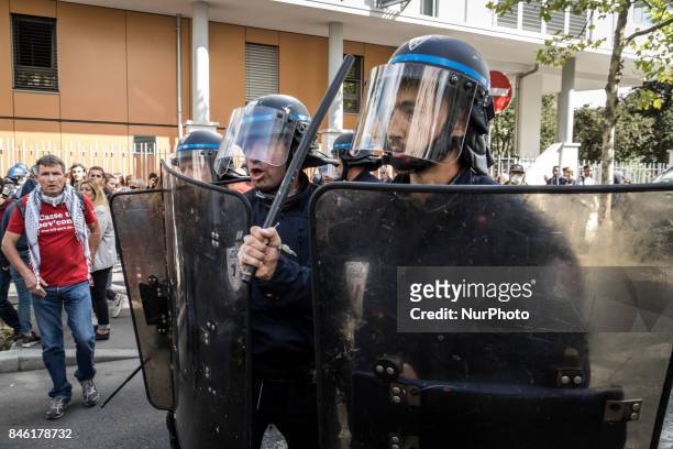 Demonstrators take part in a protest called by several French unions against the labour law reform in Lyon, on September 12, 2017. French unions...