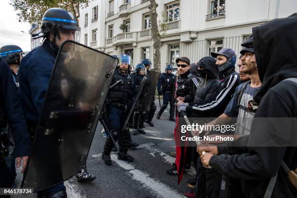 Demonstrators take part in a protest called by several French unions against the labour law reform in Lyon, on September 12, 2017. French unions...