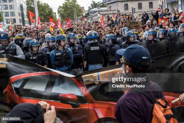 Demonstrators take part in a protest called by several French unions against the labour law reform in Lyon, on September 12, 2017. French unions...