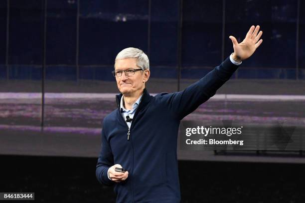 Tim Cook, chief executive officer of Apple Inc., waves after speaking during an event at the Steve Jobs Theater in Cupertino, California, U.S., on...