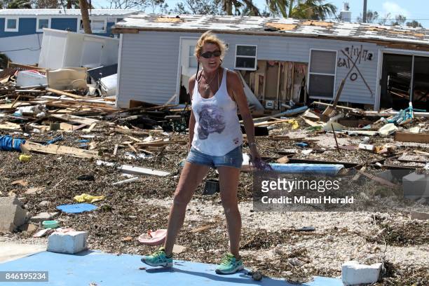 Patty Purdo checks the damage at the Seabreeze trailer park along the Overseas Highway in the Florida Keys on Tuesday, Sept. 12, 2017.
