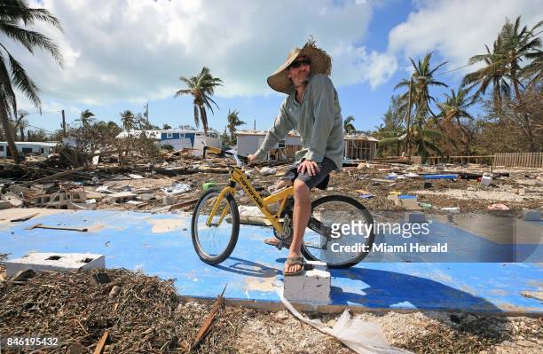 Billy Quinn sits on his bike and the concrete slab where his trailer once stood at the Seabreeze trailer park along the Overseas Highway in the...