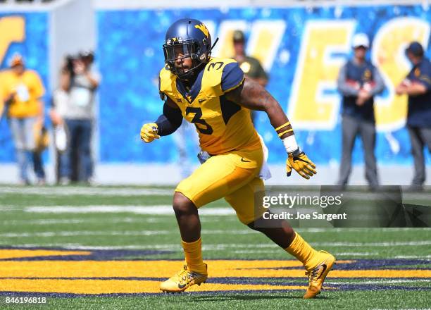 Al-Rasheed Benton of the West Virginia Mountaineers in action during the game against the East Carolina Pirates at Mountaineer Field on September 9,...