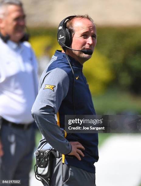 Head coach Dana Holgorsen of the West Virginia Mountaineers looks on during the game against the East Carolina Pirates at Mountaineer Field on...