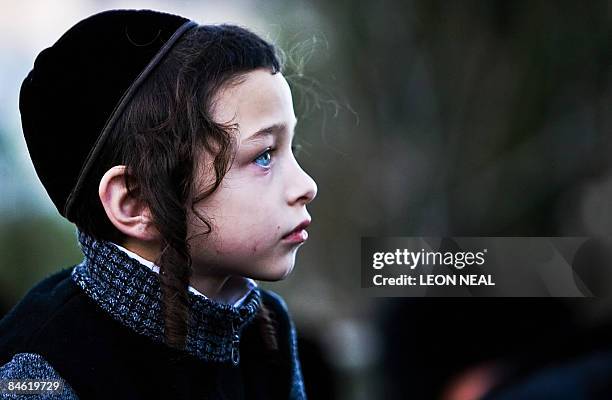 An ultra-Orthodox Jewish boy attends a religious Hasidic wedding celebration in the heart of Jerusalem on February 3, 2009. The Hasidic sect is a...