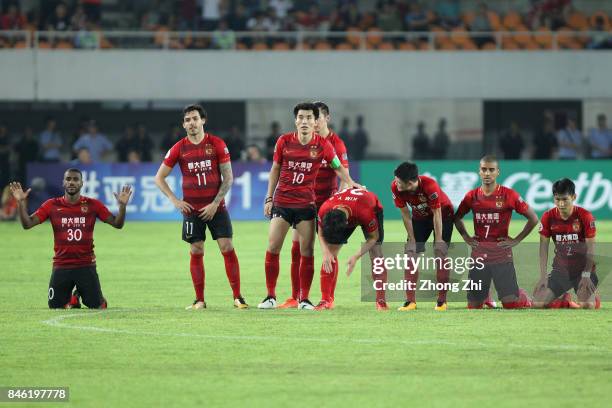 Players of Guangzhou Evergrande react during the penalty of the AFC Champions League 2017 Quarterfinals 2nd leg between Shanghai SIPG and Guangzhou...