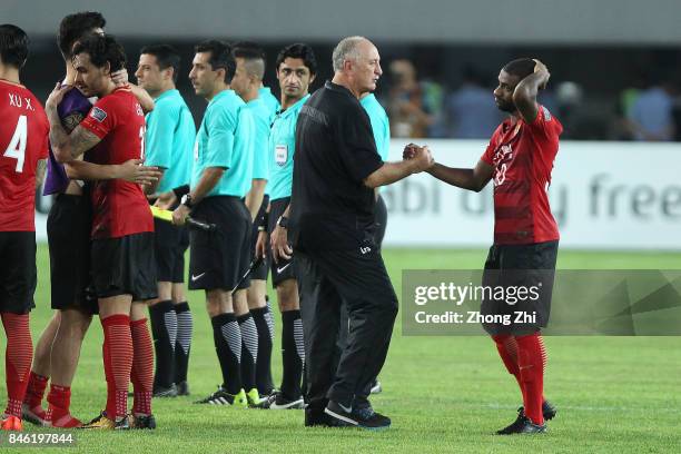 Coach Luiz Felipe Scolari of Guangzhou Evergrande comforts Luiz Da Conceicao Silva , Ricardo Goulart and team during the AFC Champions League 2017...