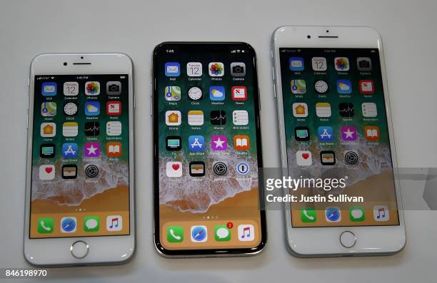 The new iPhone 8, iPhone X and iPhone 8S are displayed during an Apple special event at the Steve Jobs Theatre on the Apple Park campus on September...