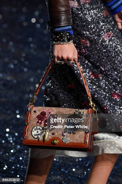 Model, bag detail, walks the runway at Coach Fashion Show during New York Fashion Week on September 12, 2017 in New York City.