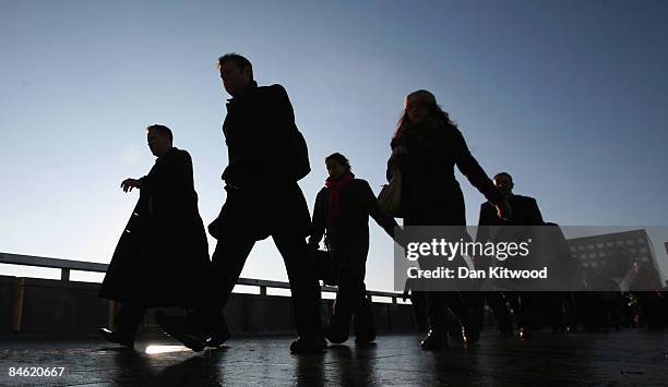 Workers return to their jobs after two days of widespread disruption caused by the snow on February 4, 2009 in London, England. The cost to the...