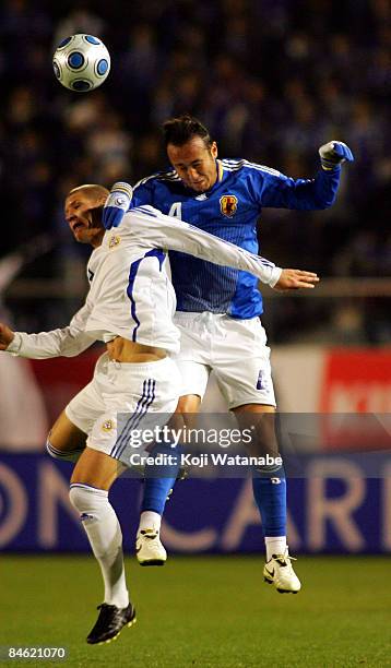 Marcus Tulio Tanaka of Japan rises above a Finnish player during the Kirin Challenge Cup 2009 match between Japan and Finland at the National Stadium...