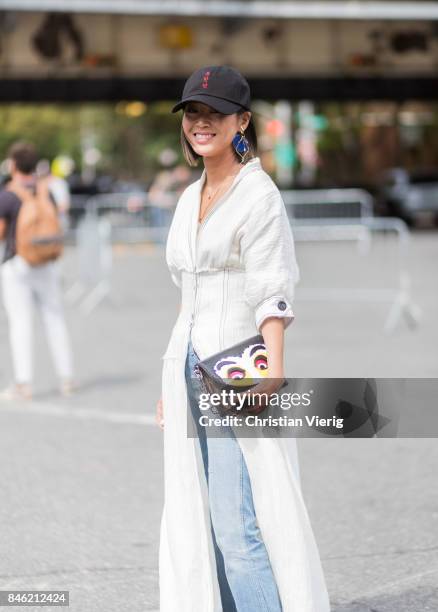 Aimee Song wearing a cap seen in the streets of Manhattan outside Coach during New York Fashion Week on September 12, 2017 in New York City.