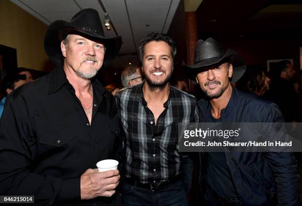 In this handout photo provided by Hand in Hand, Trace Adkins, Luke Bryan, and Tim McGraw attend Hand in Hand: A Benefit for Hurricane Relief at the...
