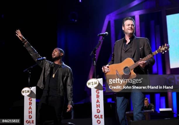 In this handout photo provided by Hand in Hand, Usher and Blake Shelton perform onstage during Hand in Hand: A Benefit for Hurricane Relief at the...