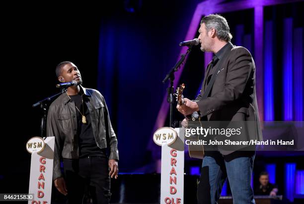 In this handout photo provided by Hand in Hand, Usher and Blake Shelton perform onstage during Hand in Hand: A Benefit for Hurricane Relief at the...