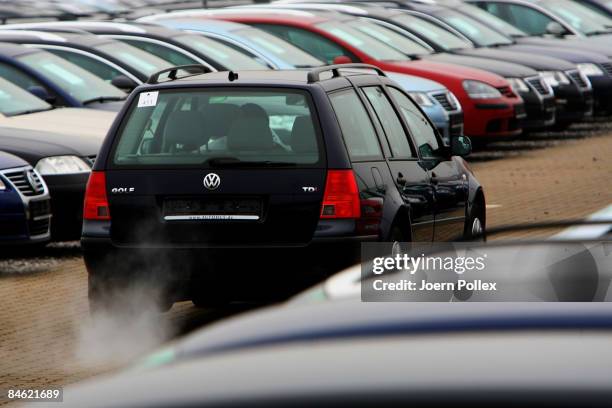 Customers are looking for a new car at a car dealer on February 4, 2009 in Bockel, Germany. The German Government supports the automobile industry in...