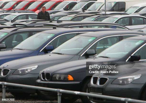 Customers are looking for a new car at a car dealer on February 4, 2009 in Bockel, Germany. The German Government supports the automobile industry in...