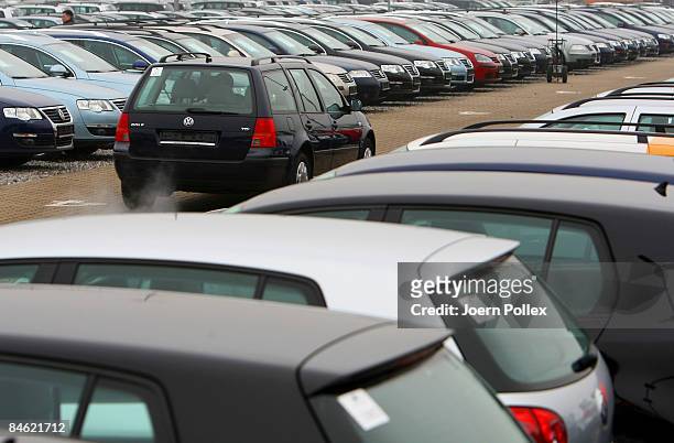 Customers are looking for a new car at a car dealer on February 4, 2009 in Bockel, Germany. The German Government supports the automobile industry in...