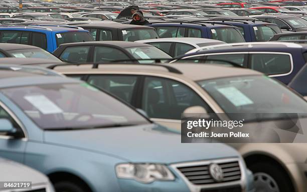 Customers are looking for a new car at a car dealer on February 4, 2009 in Bockel, Germany. The German Government supports the automobile industry in...