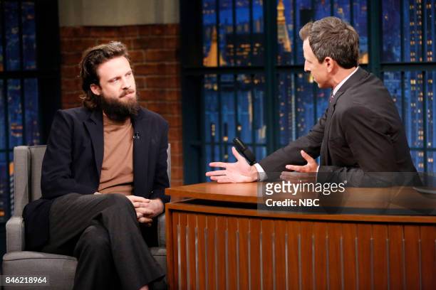 Episode 576 -- Pictured: Musical guest Father John Misty talks with host Seth Meyers during an interview on September 12, 2017 --