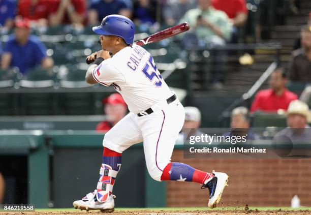 Willie Calhoun of the Texas Rangers gets his first MLB rbi in the second inning against the Seattle Mariners at Globe Life Park in Arlington on...