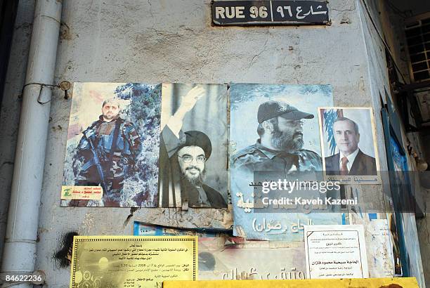 Pictures of Michel Suleiman, Imad Mughniyeh, Hasan Nasrollah and Mohammad Mahmud Vahid, a martyred Hezbollah fighter, are posted on the wall, on a...