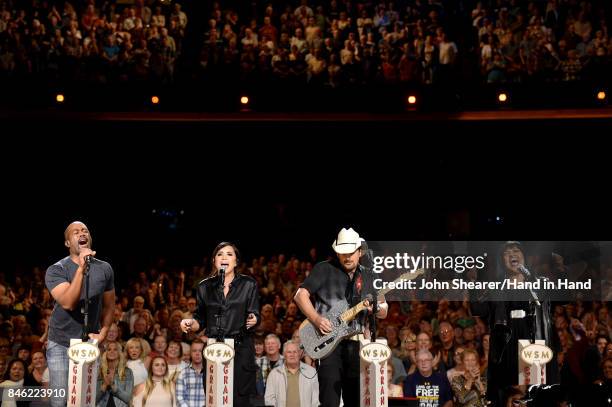 In this handout photo provided by Hand in Hand, Darius Rucker, Demi Lovato, Brad Paisley, and CeCe Winans perform onstage during Hand in Hand: A...