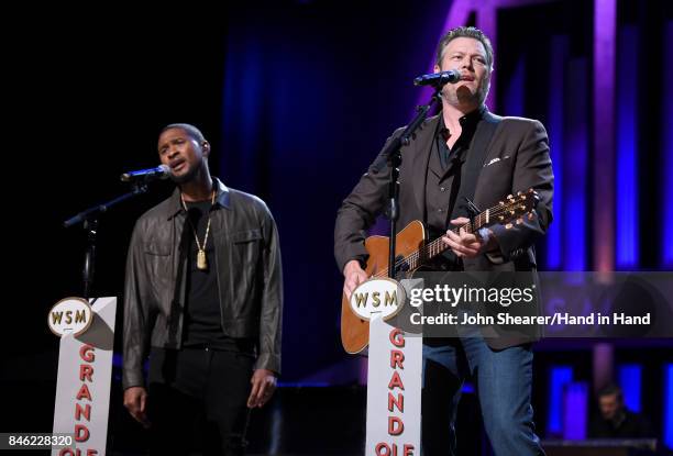 In this handout photo provided by Hand in Hand, Usher and Blake Shelton perform onstage during Hand in Hand: A Benefit for Hurricane Relief at the...